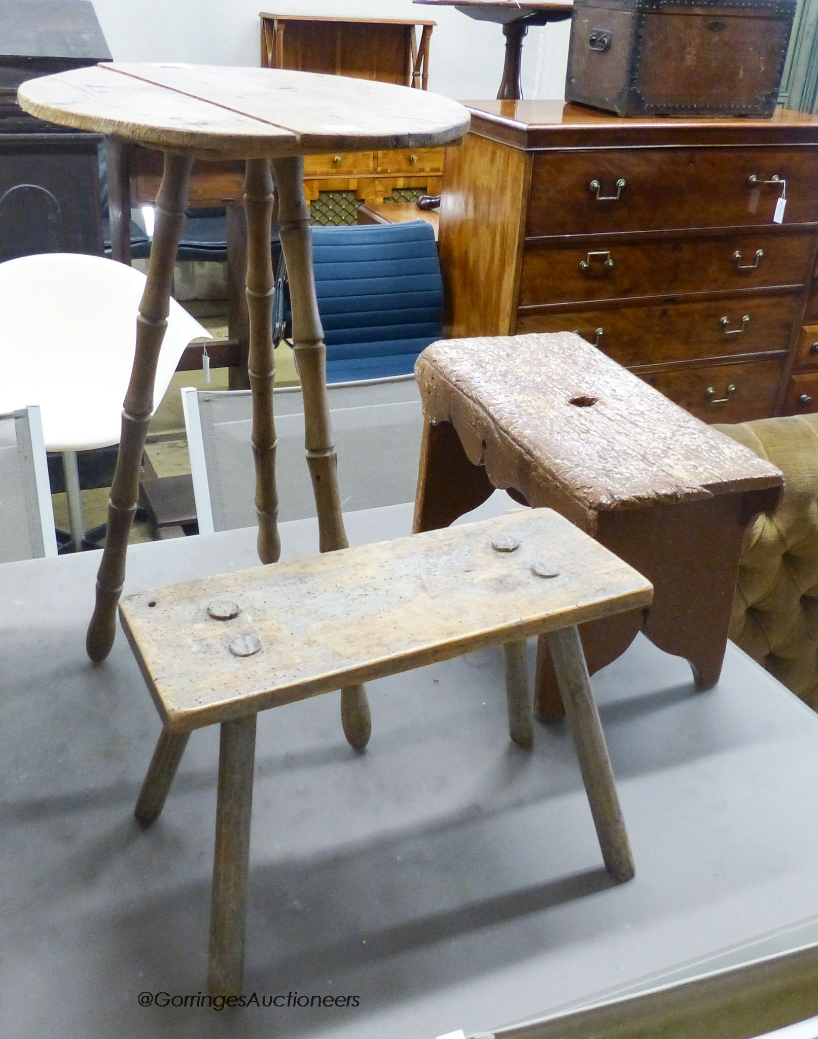 A pine gyspy table, width 43cm, height 67cm, together with two provinical stools